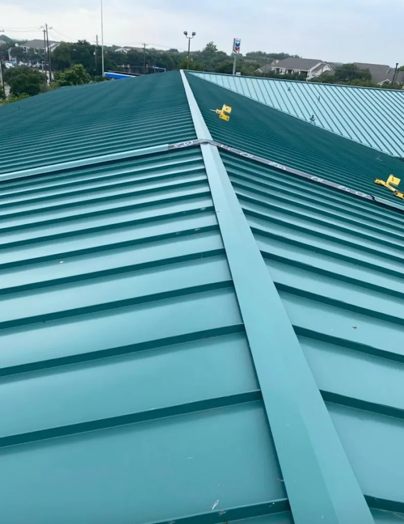 Green commercial metal roof ridge and valley for Metal Roof Repair in Clear Lake